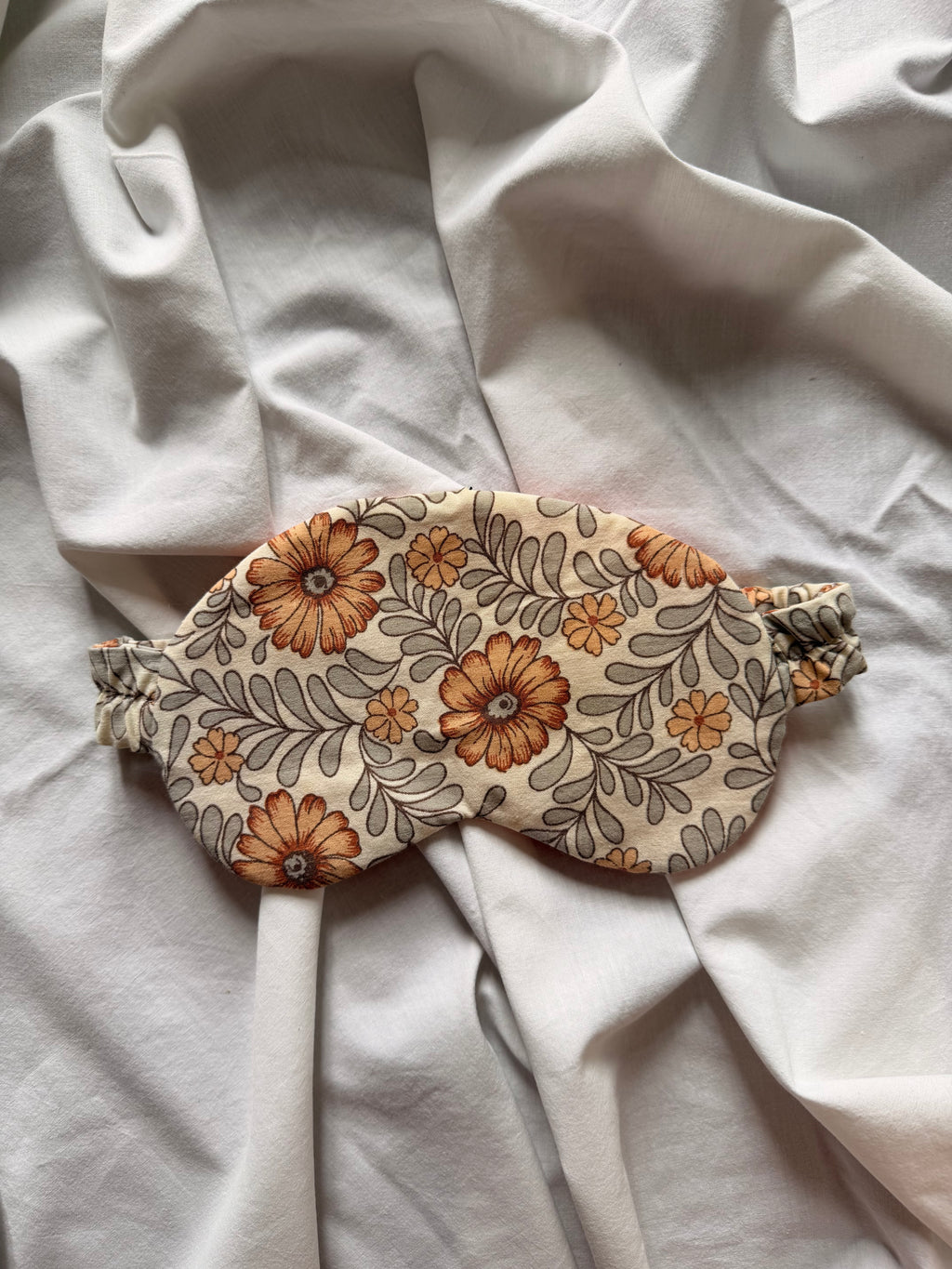 Masque de nuit fleuri orange